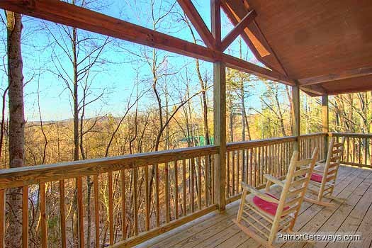 Upper level deck with rocking chairs at Paradise Found, a 1 bedroom cabin rental located in Gatlinburg